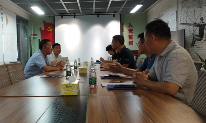 金百利真人游戏国际控股党委开展党建事情调研交流-新闻中心